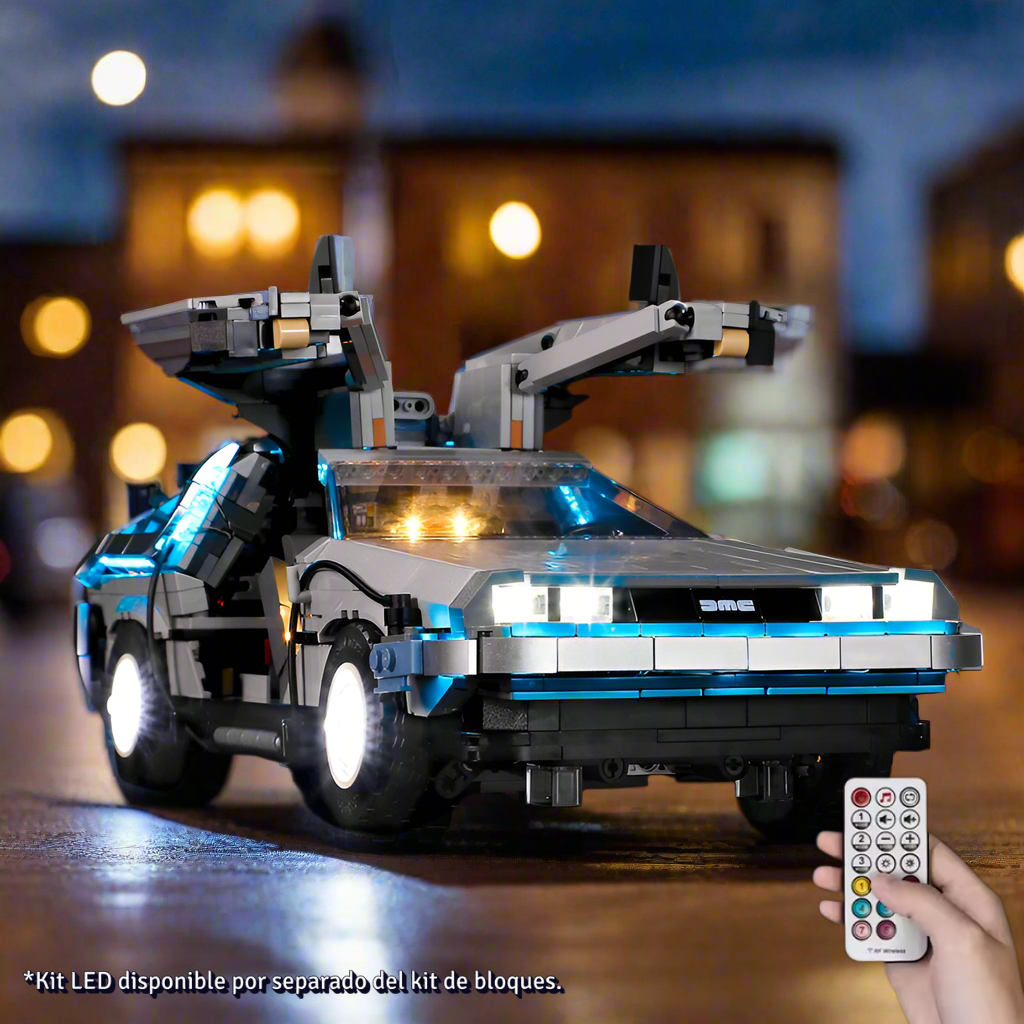 Toy model of a futuristic car resembling the DeLorean from Back to the Future on a wooden surface.